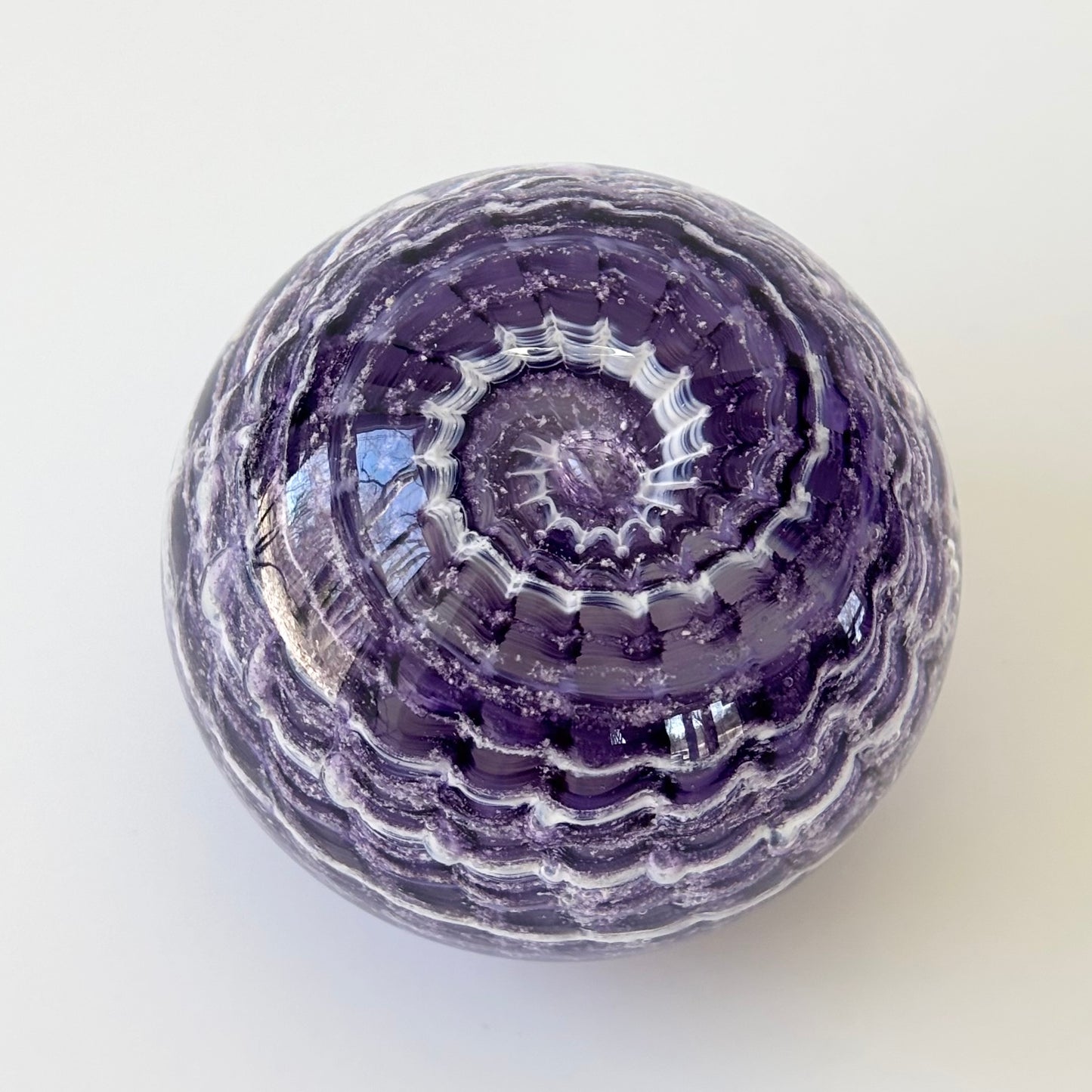 Personalized cremains memorial glass orb in handmade ripple design with ash integration
