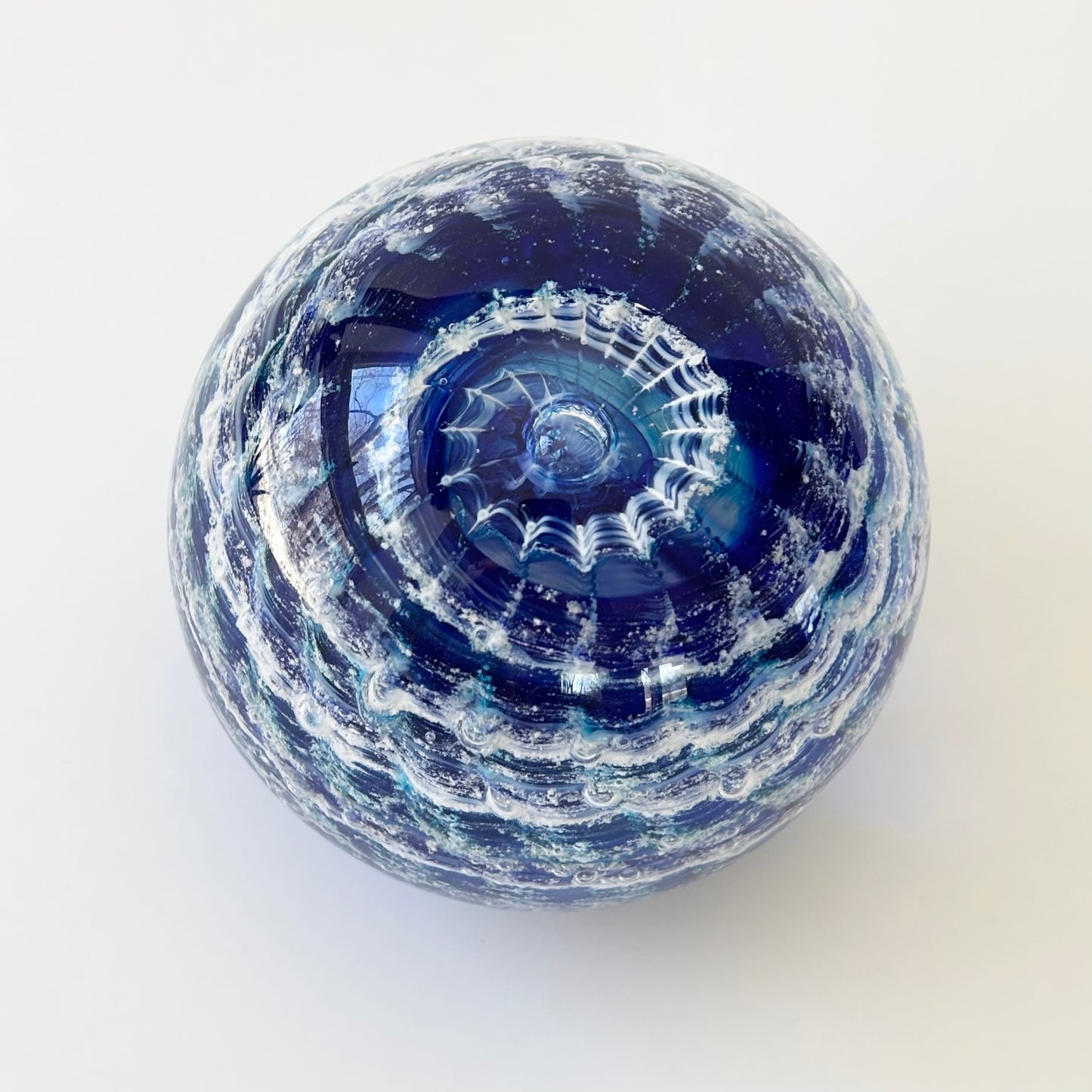 Rippled glass tribute featuring ashes and calming earth-tone swirl colors for lasting remembrance