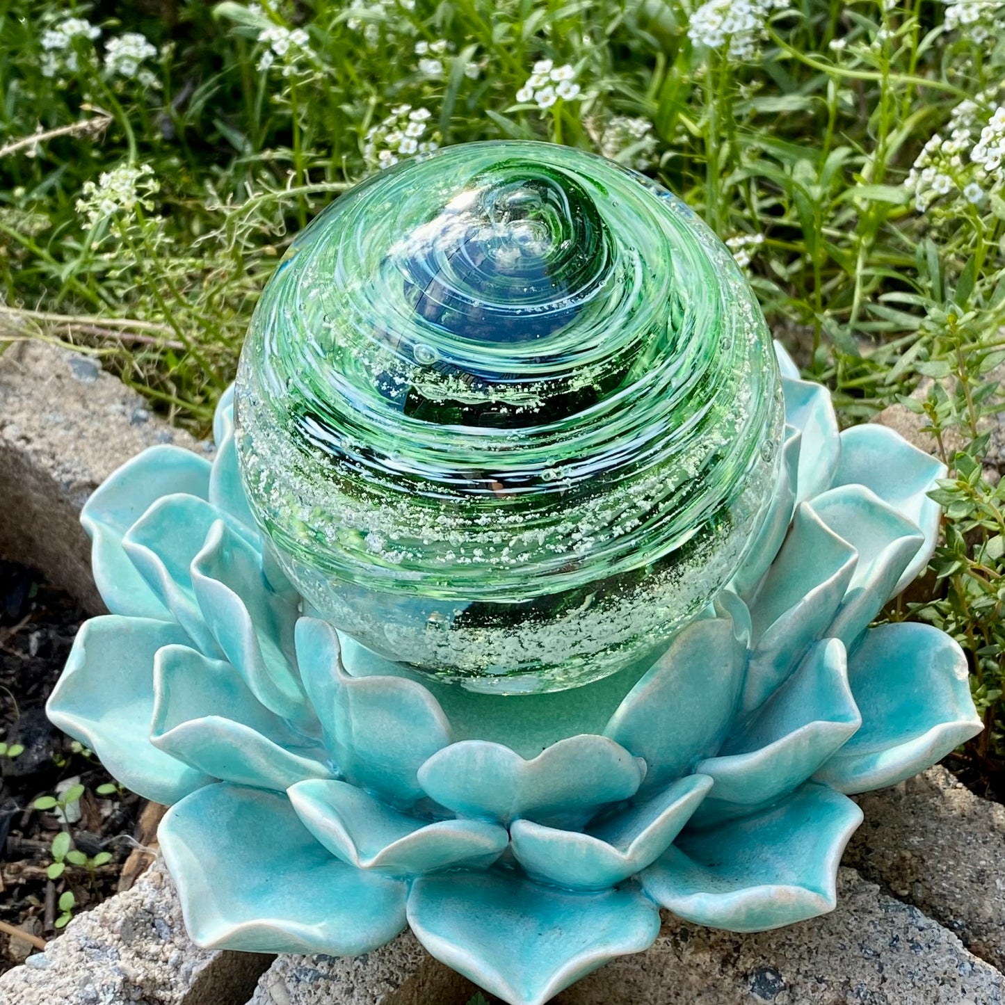 Custom ash-infused glass memorial sphere in green sparkle and white