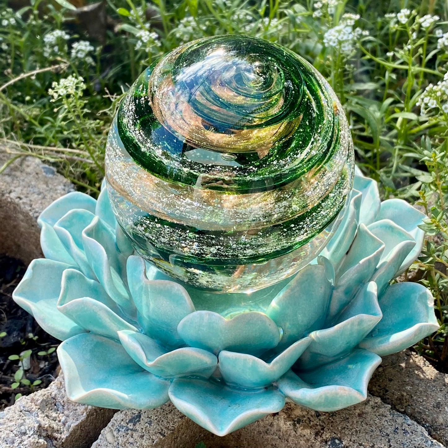 aventurine green and gold sparkle paperweight with ashes infused in molten glass