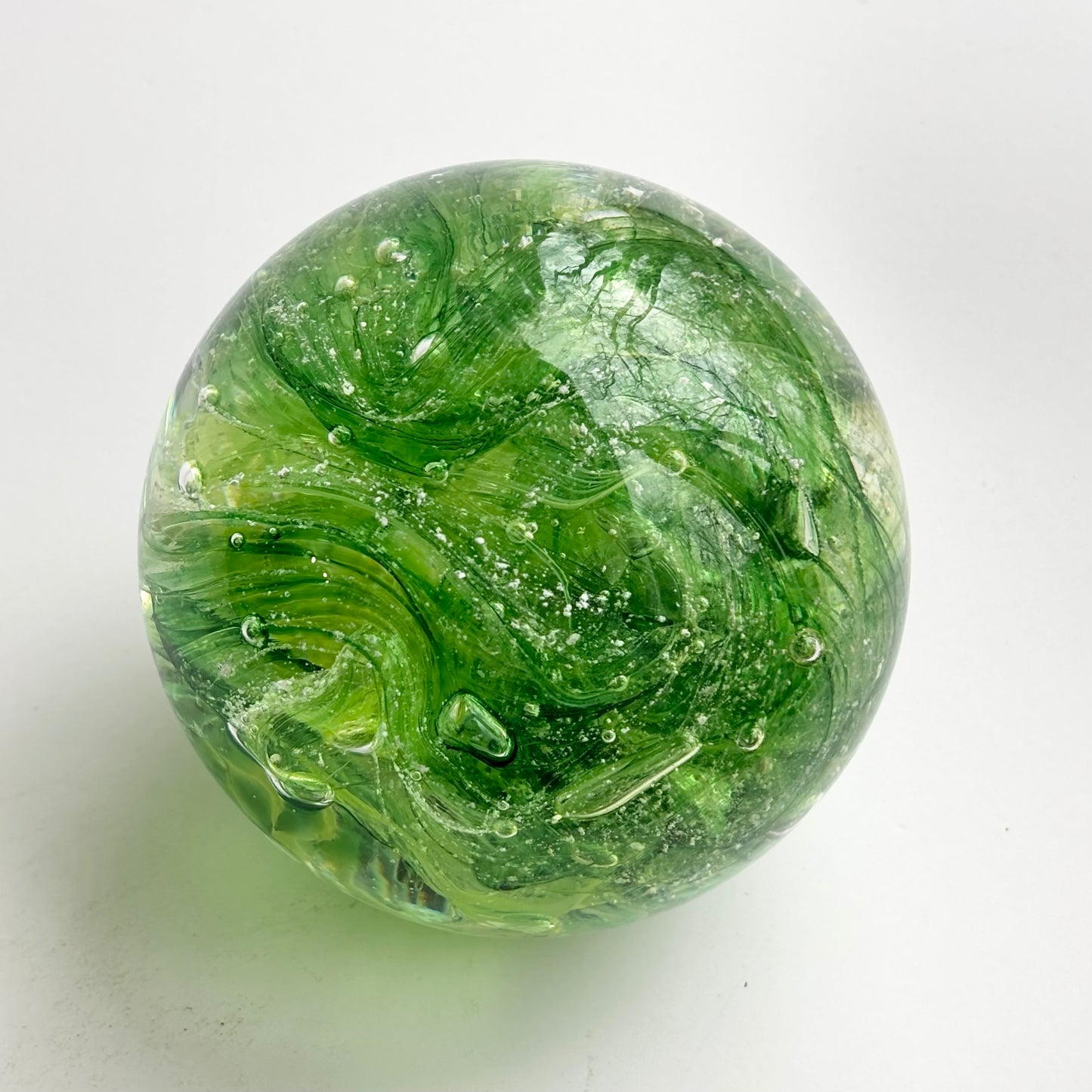 lime green cremation memorial orb with ribboned or marbled design pattern