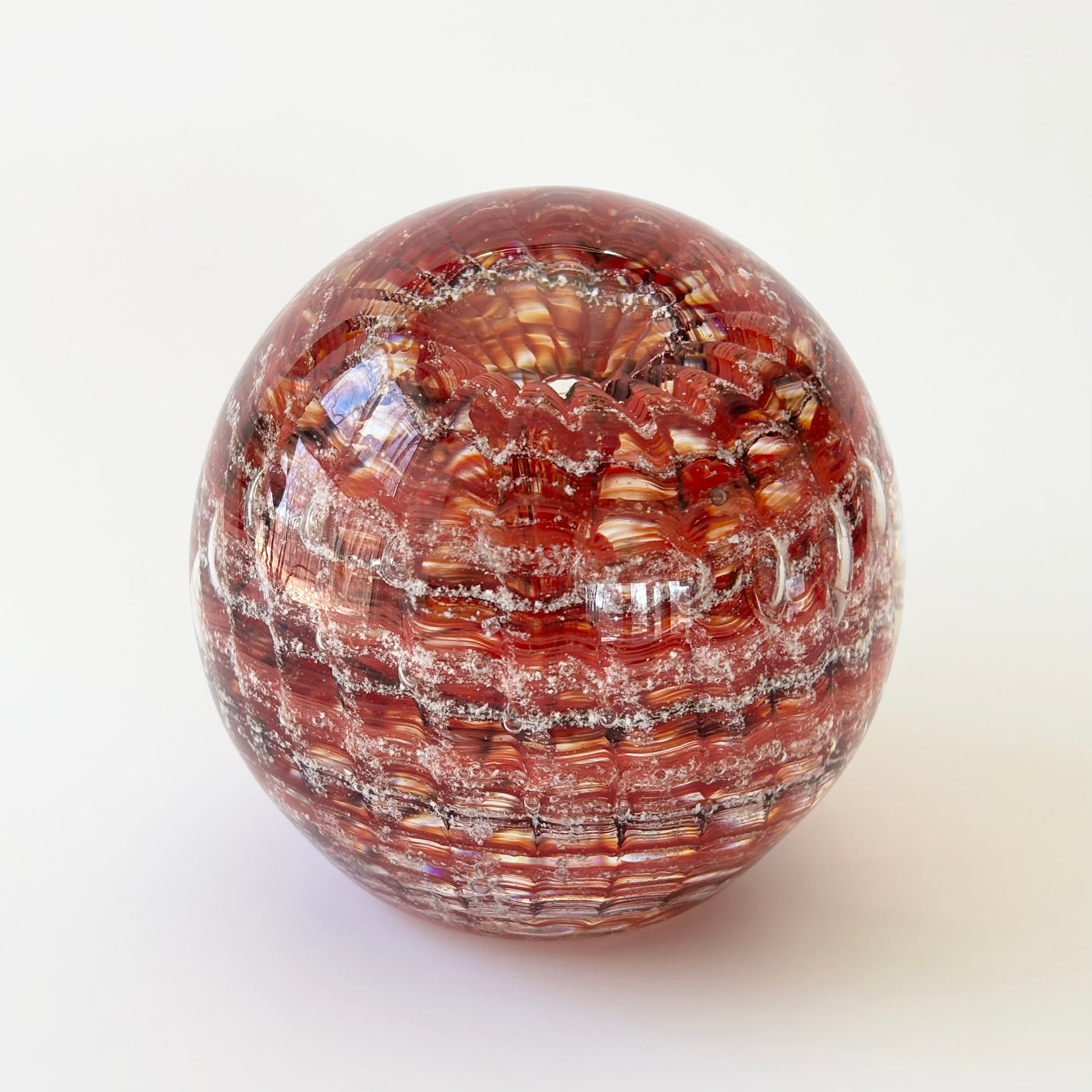 Cremation glass artwork with ashes preserved in ripple lines and layered glass color tones