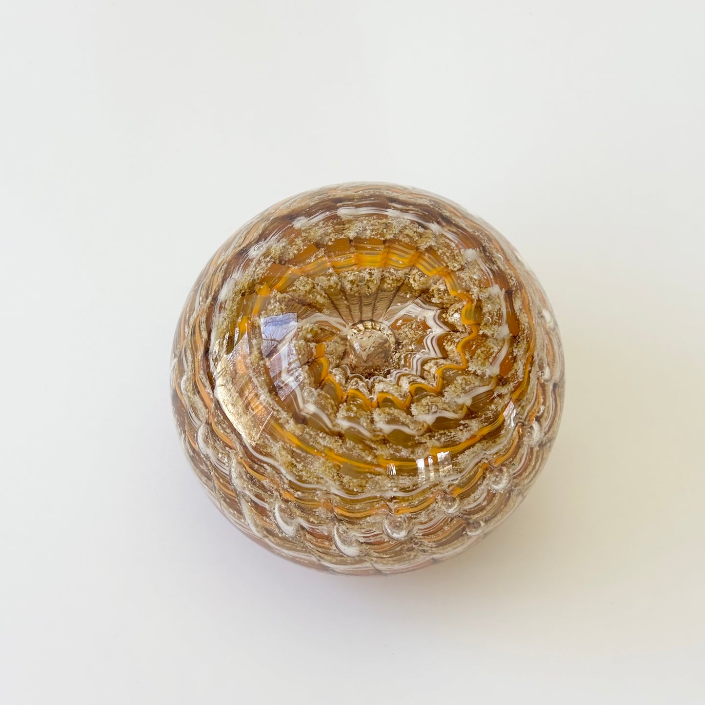 Handcrafted glass paperweight with ashes suspended in a calming ripple swirl of custom colors

