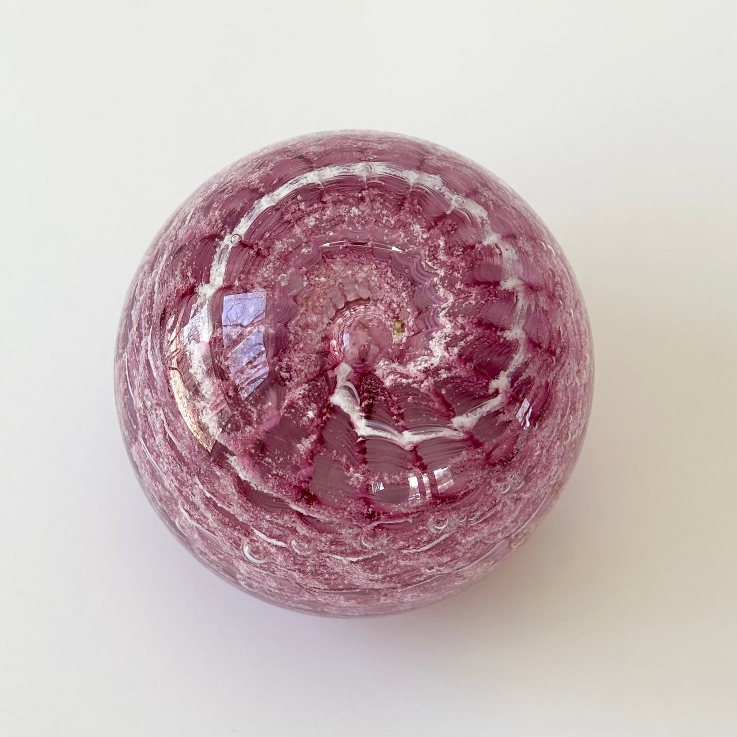 Pet remembrance keepsake made with ashes and fur-inspired glass color tones in vortex swirl