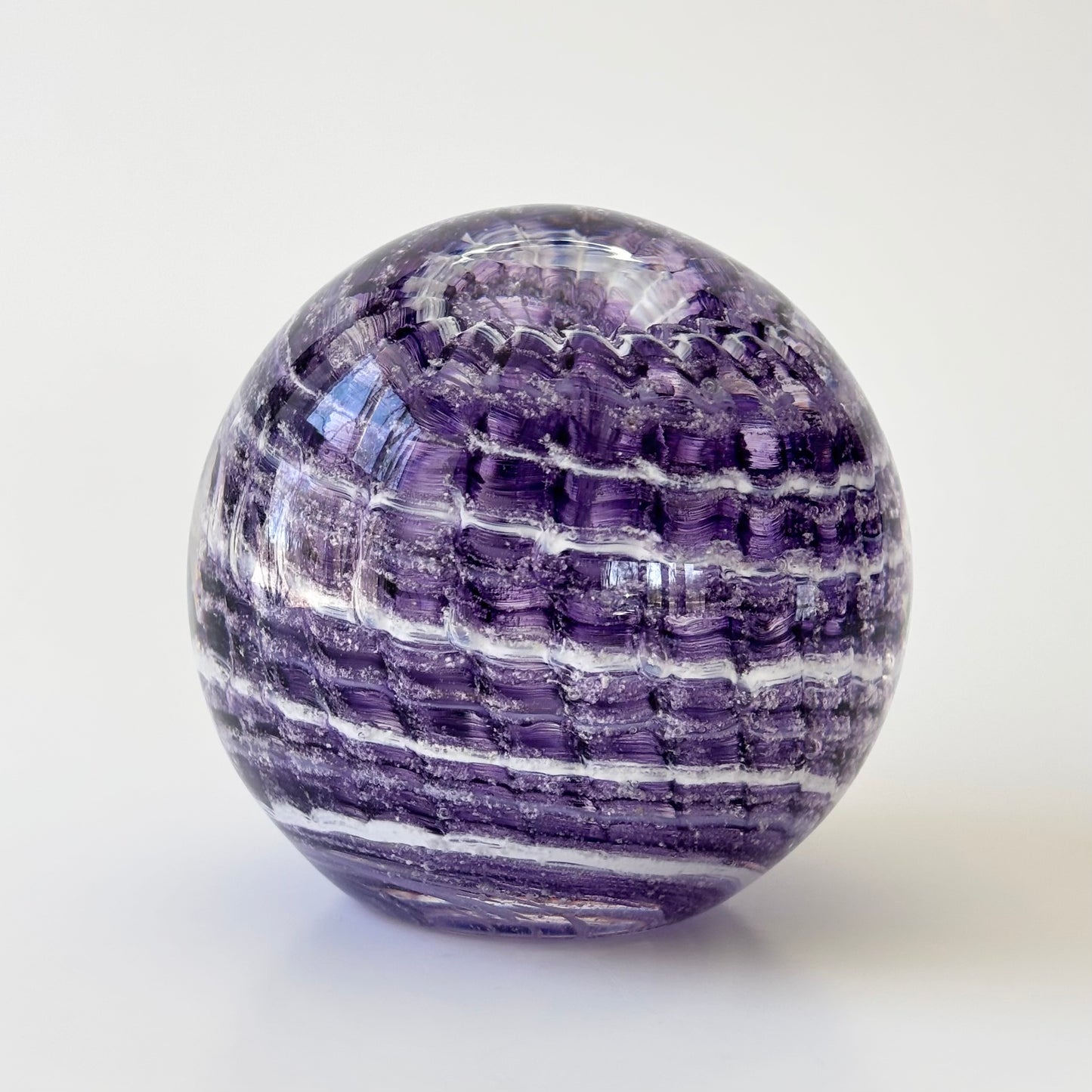 Glass tribute infused with ashes, featuring ridged ripple sides and pet-inspired color accents

