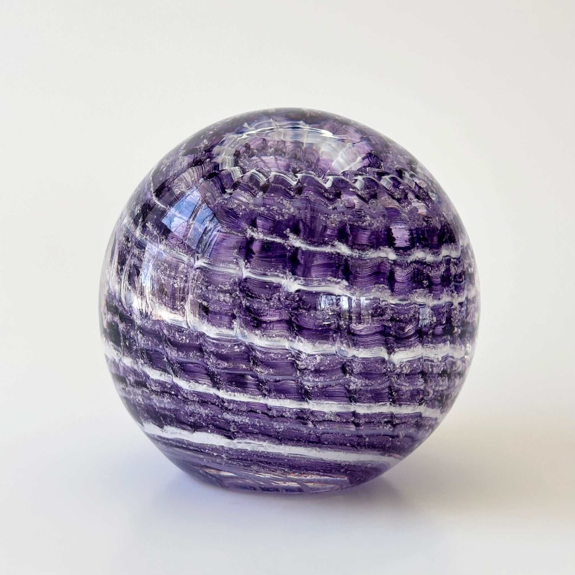 Glass tribute infused with ashes, featuring ridged ripple sides and pet-inspired color accents

