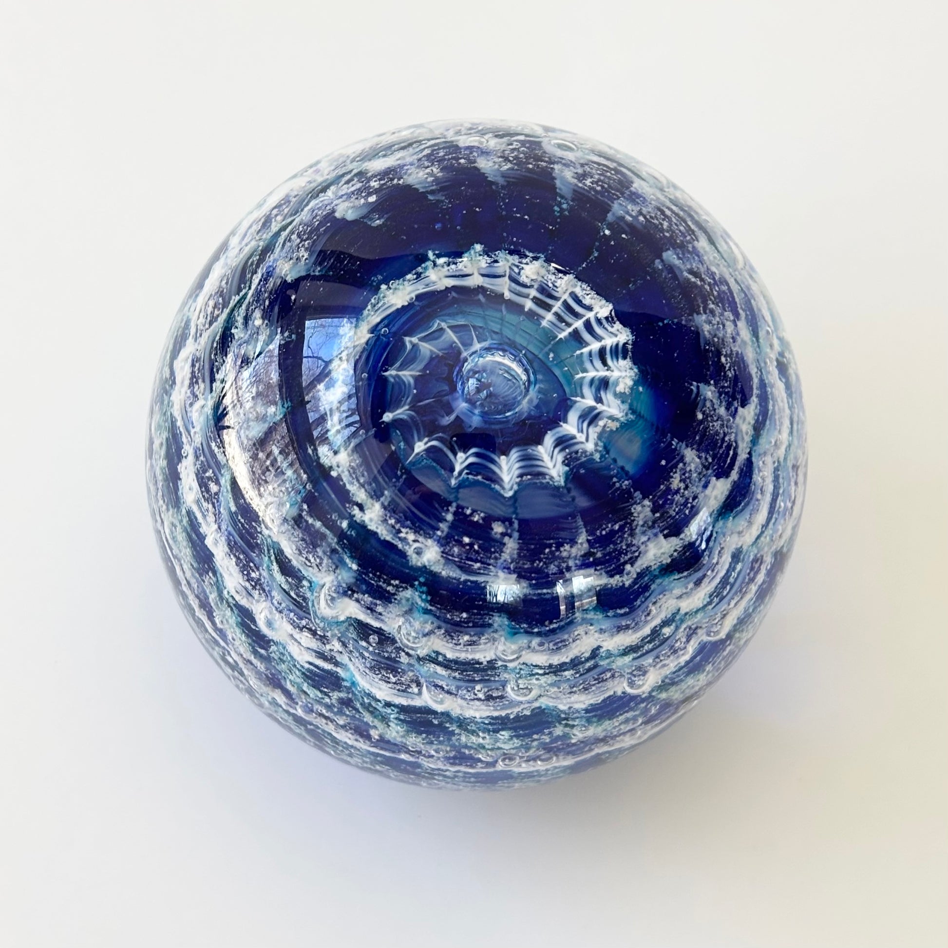 Rippled glass tribute featuring ashes and calming earth-tone swirl colors for lasting remembrance
