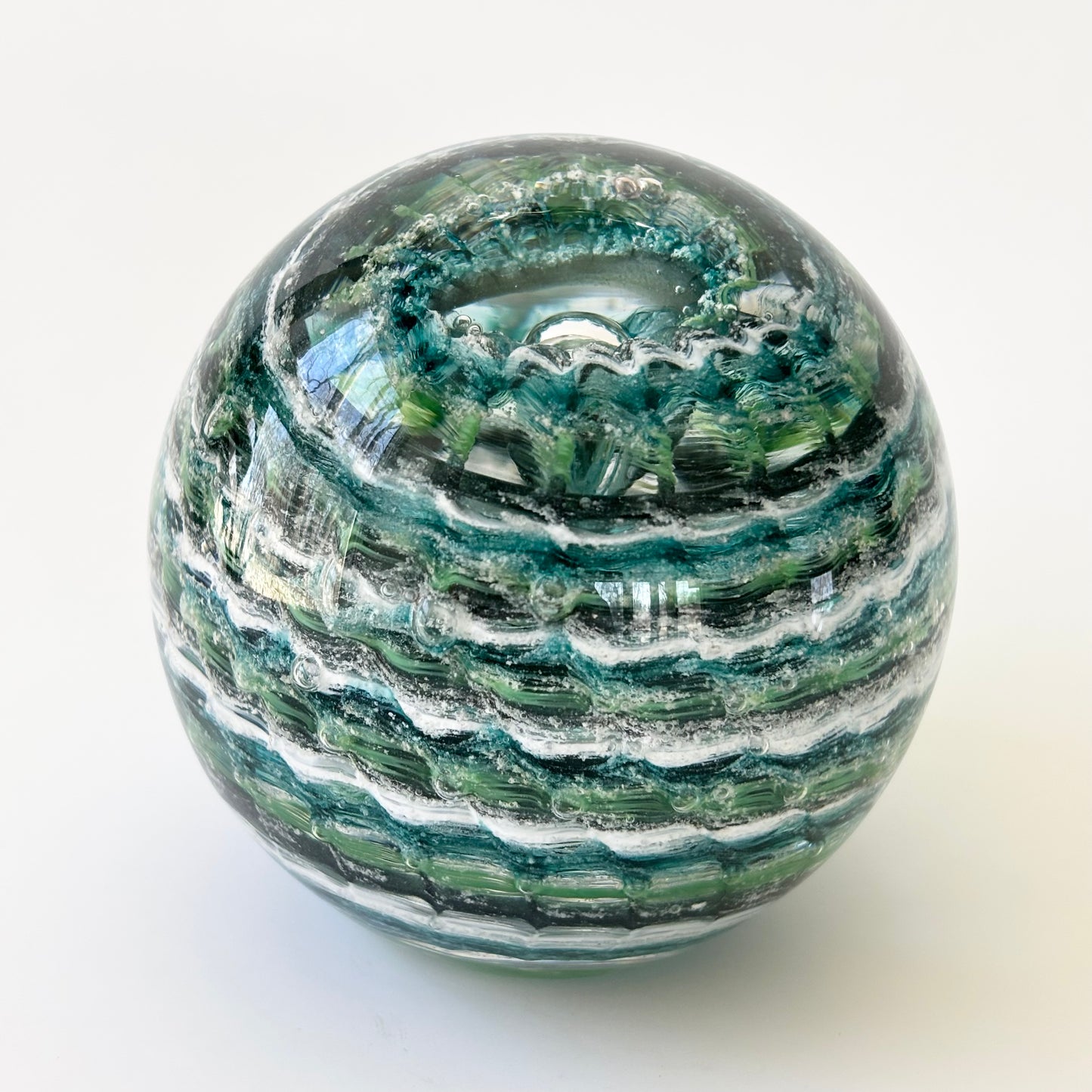 Rippled glass orb made to honor pets or people, infused with ashes and timeless color combinations