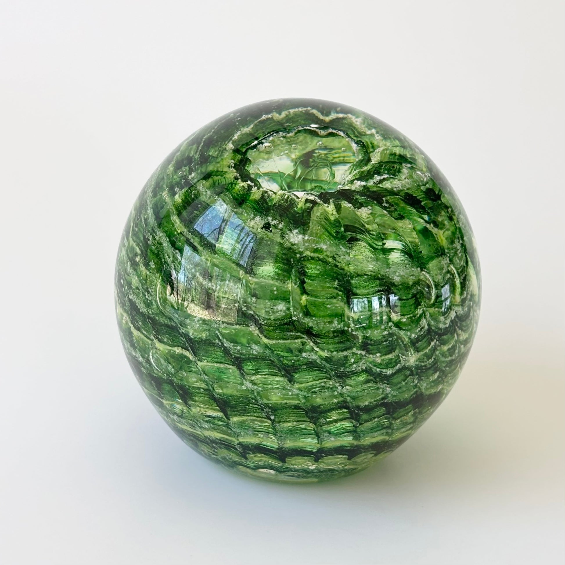 Custom ash memorial with rippled texture and transparent glass layers encasing cremains