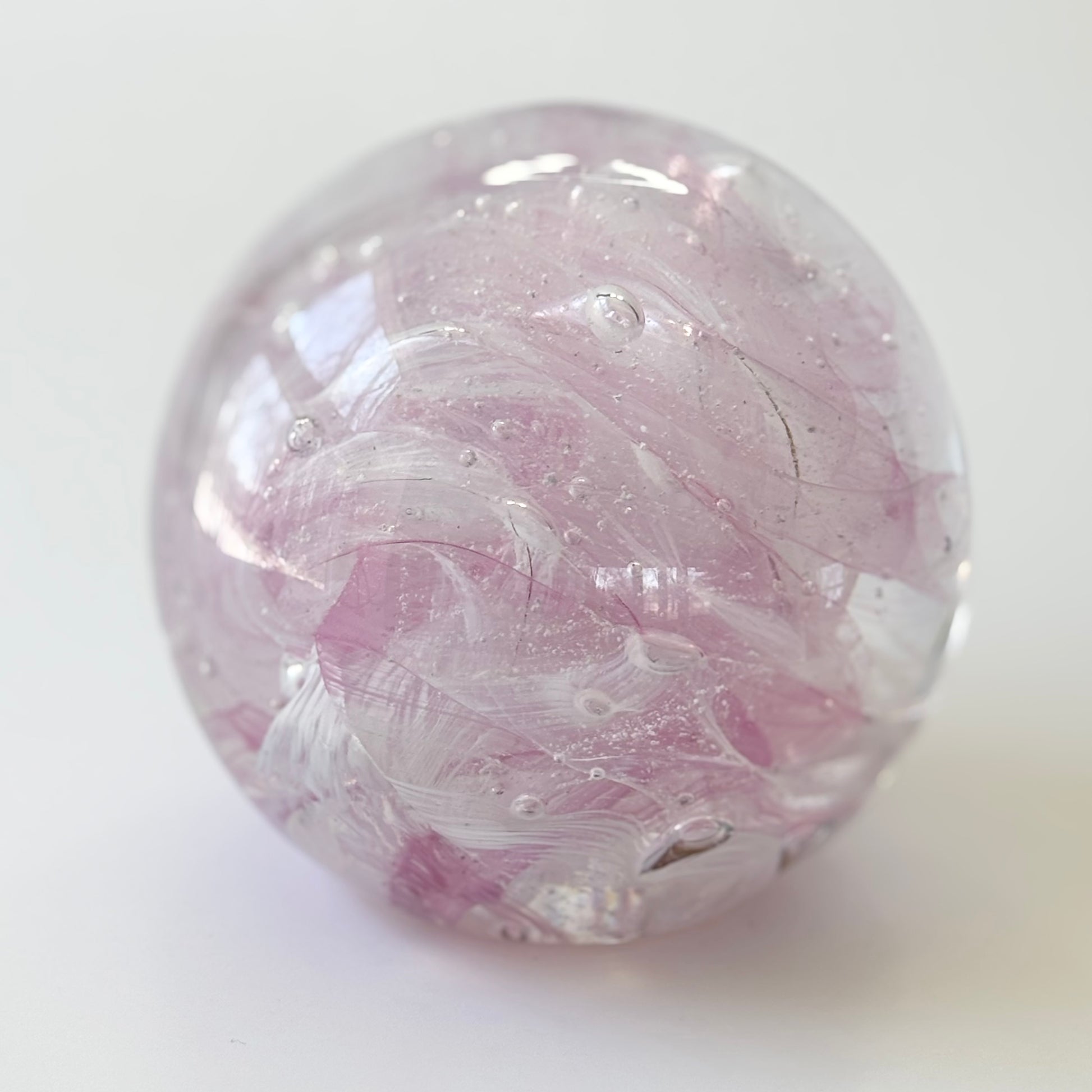baby pink cremation memorial orb with ribboned or marbled design pattern