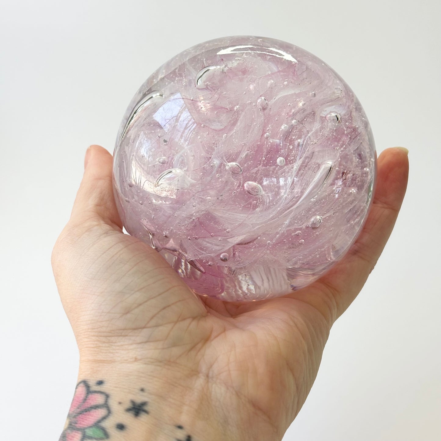 baby pink cremation memorial orb with ribboned or marbled design pattern