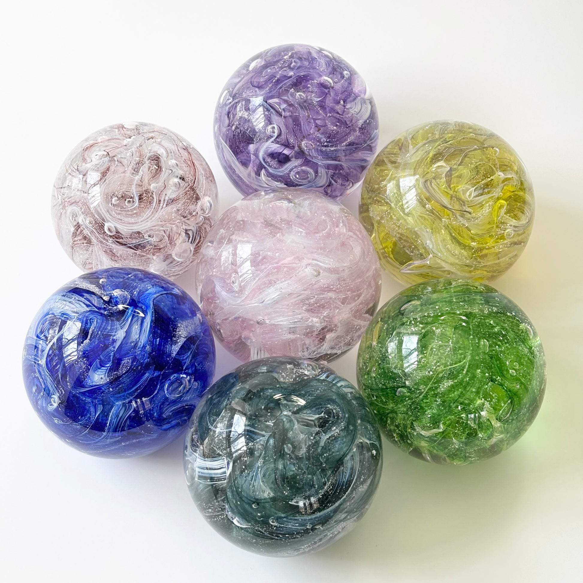 glass tribute orb with handcrafted motion and swirling ashes various color combinations