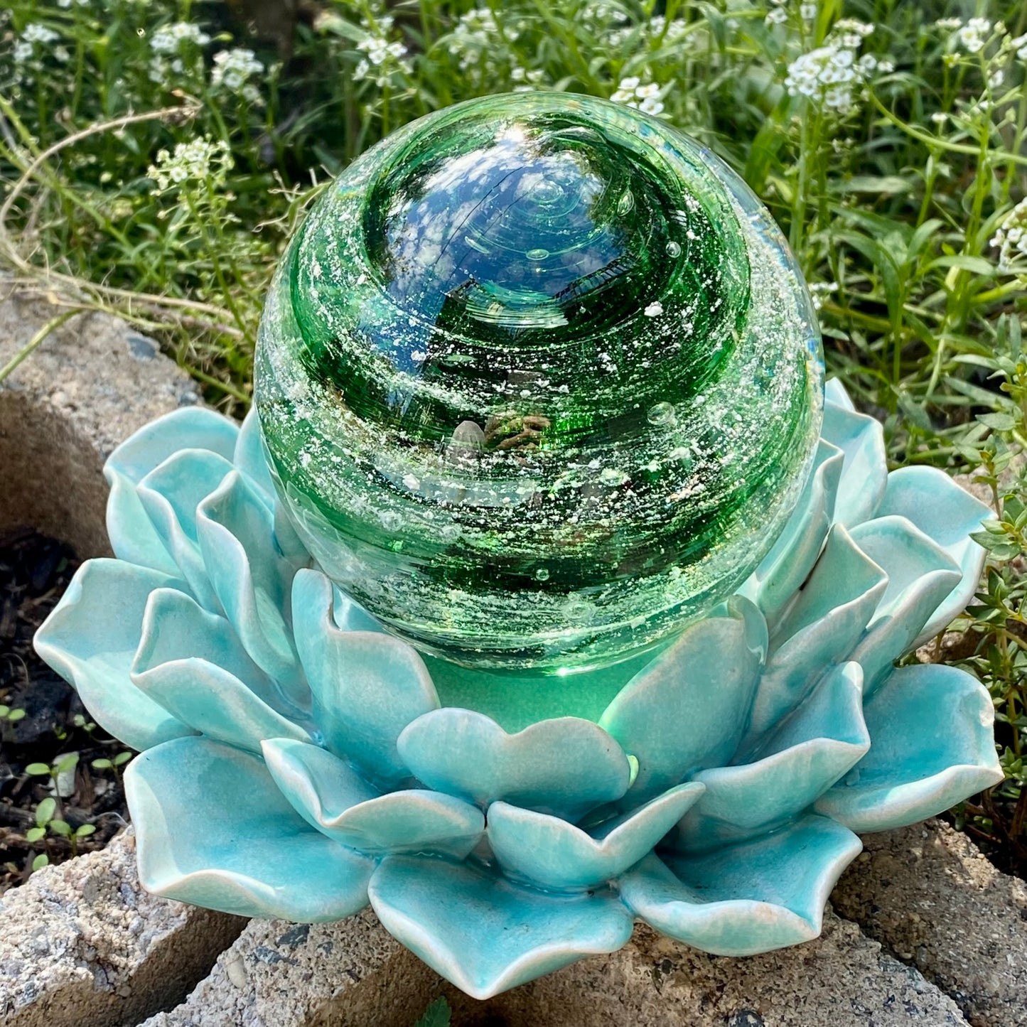 Beautiful green swirl of cremains infused into a pet memorial glass paperweight