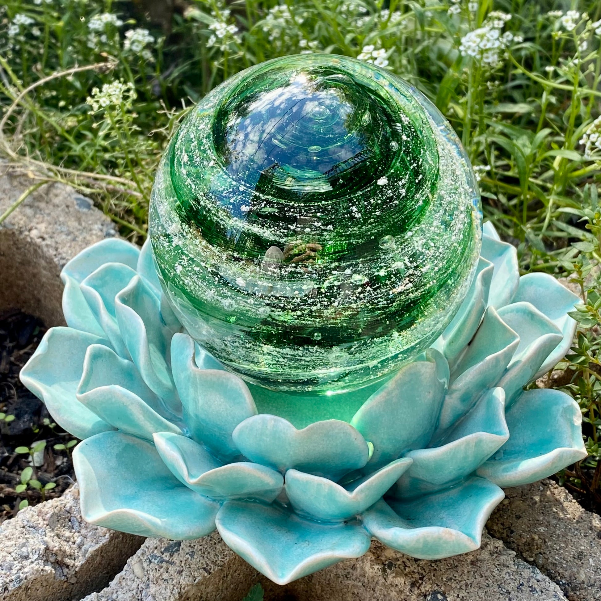 Beautiful green swirl of cremains infused into a pet memorial glass paperweight