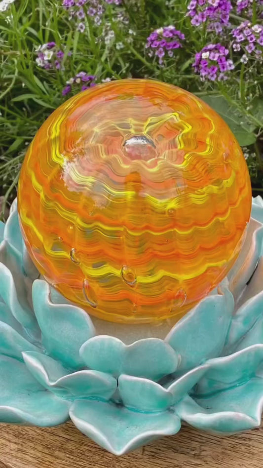 Making a custom glass memorial with molten glass and infused ashes. 